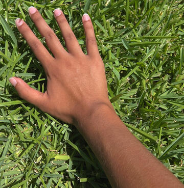 photo of my hand on grass